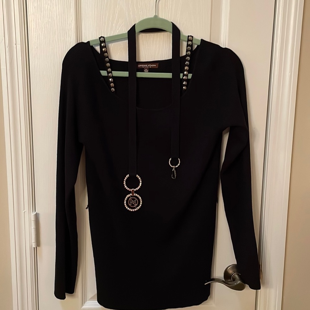 Black long sleeve sweater with belt.